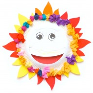Use a paper dish and add some color papers to compose a sunflower
